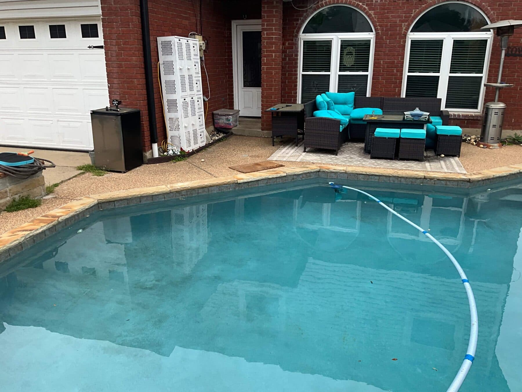 Finished Santa Fe pool deck with backyard lounge seating