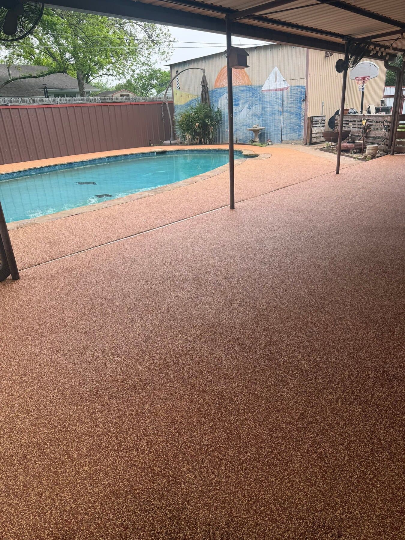Finished warm red and orange Santa Fe pool deck