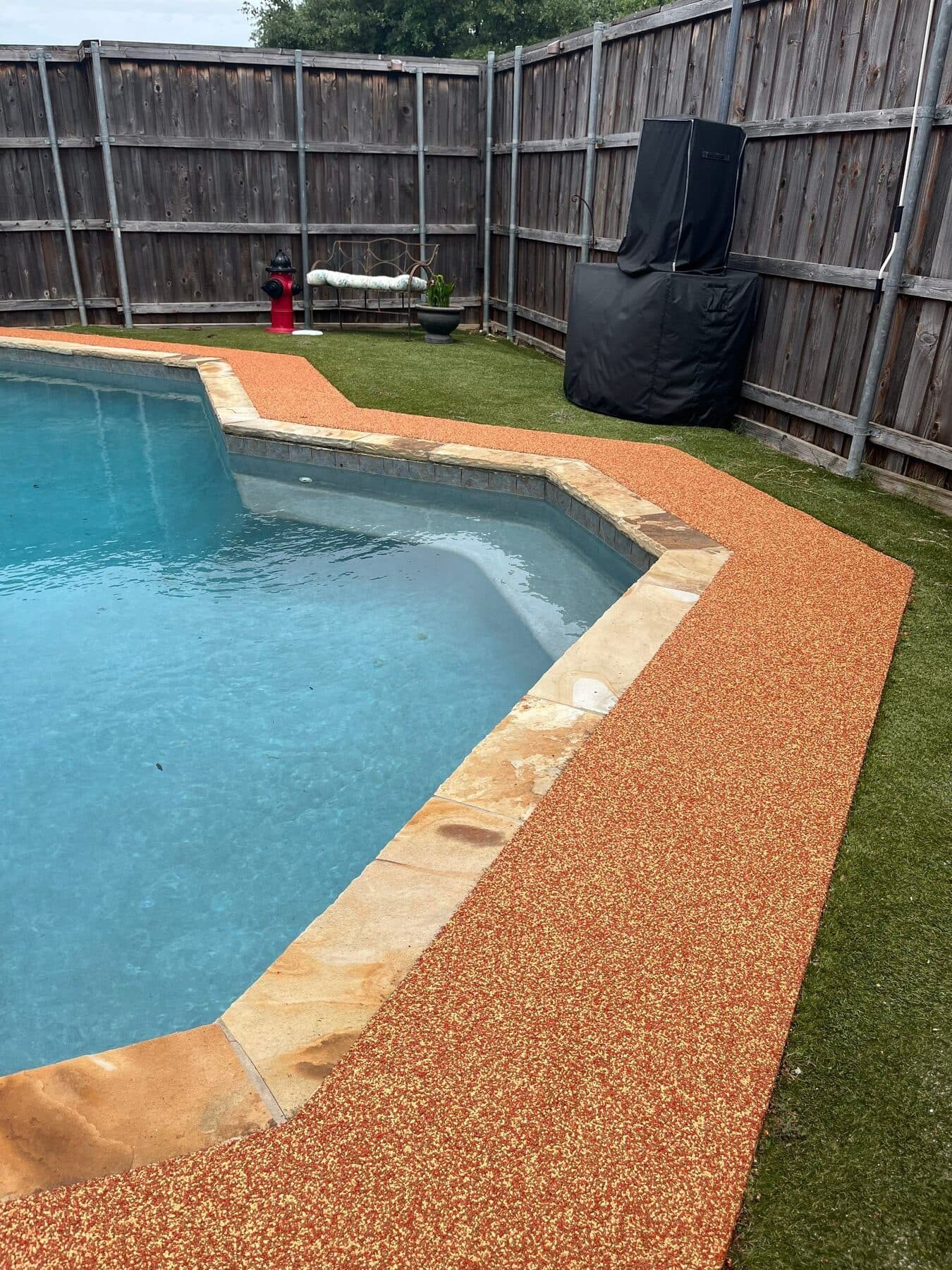 Finished Santa Fe surface along a residential pool edge