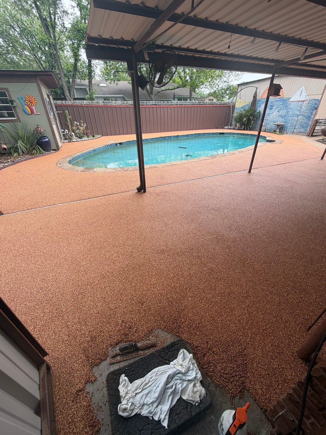 Finished Santa Fe pool deck inside a screened enclosure