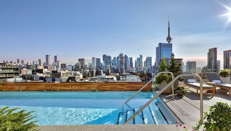 Rubaroc rooftop pool deck with a city skyline view