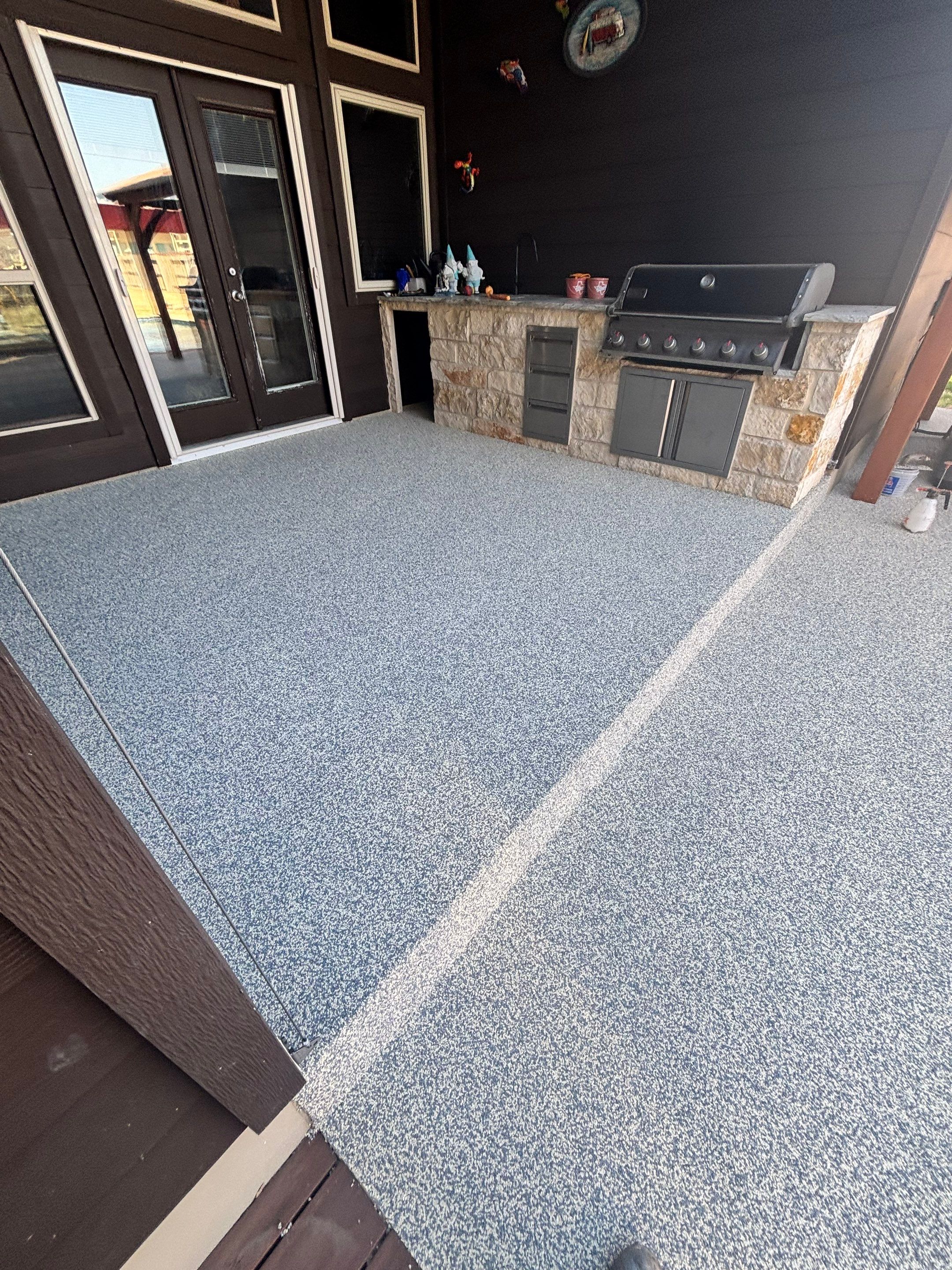 Resurfaced patio in Arkansas with a hand-troweled EPDM rubber finish, the kind of result homeowners weigh against patio resurfacing cost in Arkansas