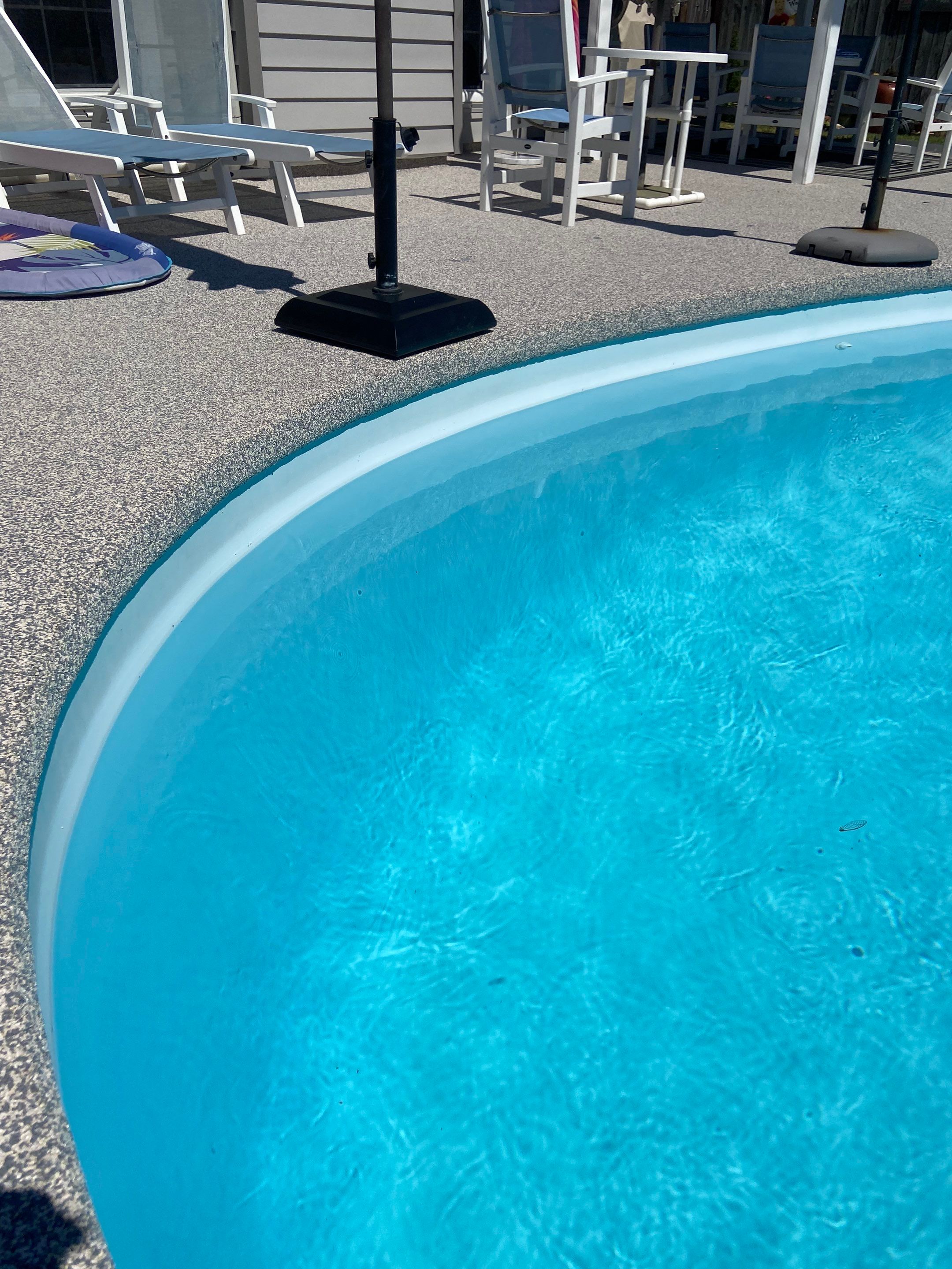 Pool deck resurfacing Jacksonville AR with a hand-troweled rubber finish over existing concrete