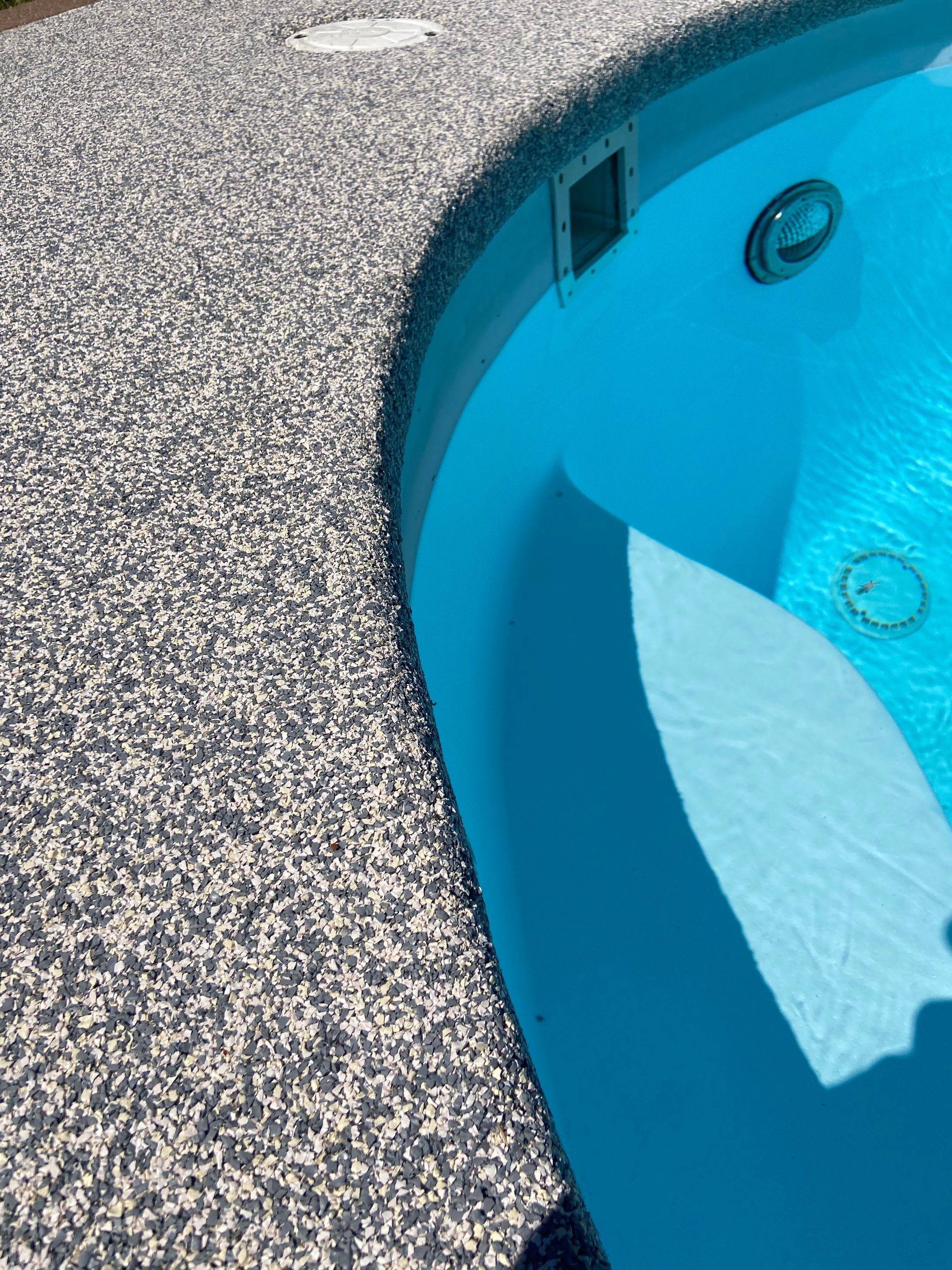 Pool deck resurfacing cost Arkansas homeowners weigh when choosing a hand-troweled rubber finish around a backyard pool