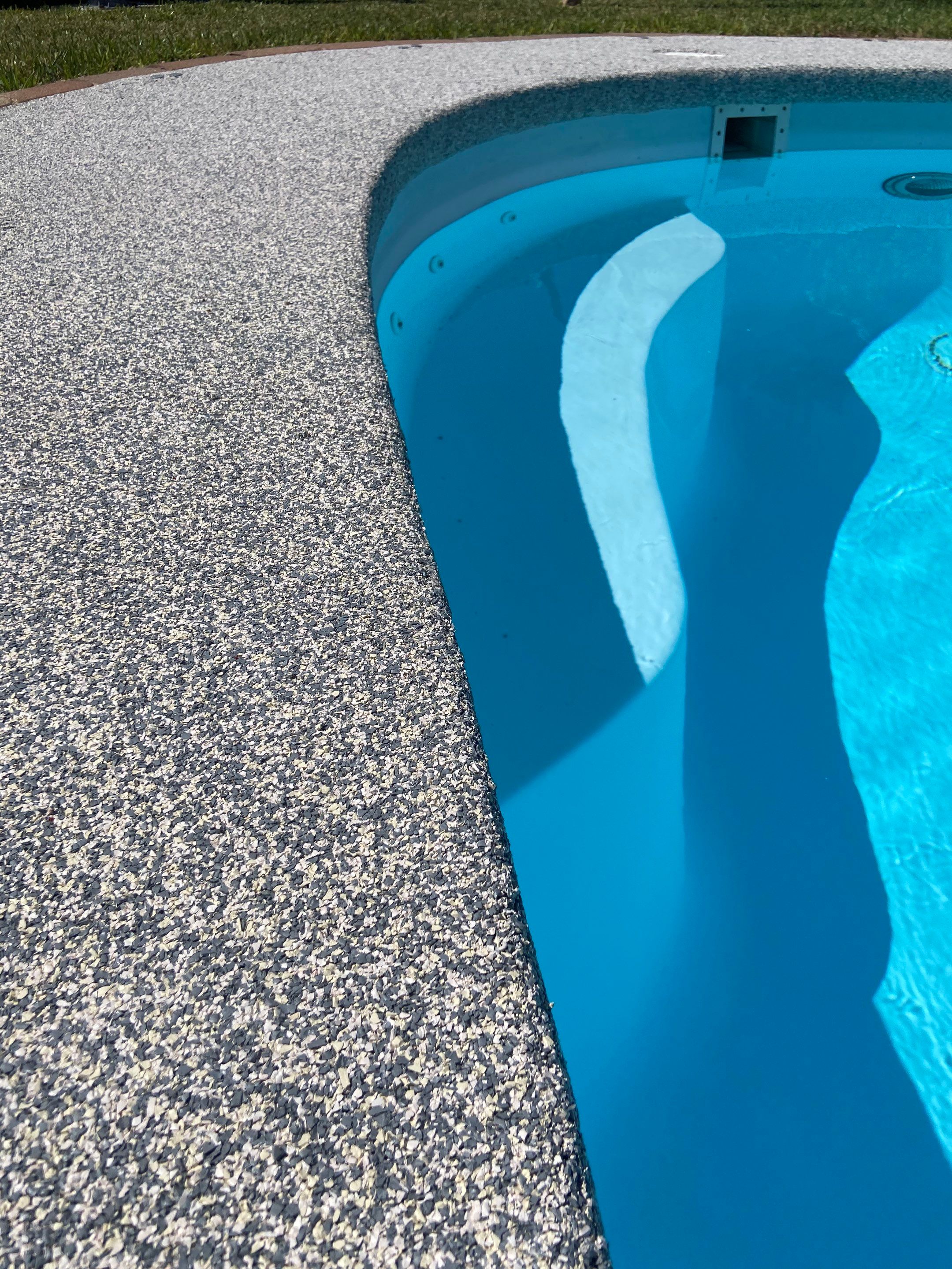 Pool deck resurfacing Conway AR with Fox's hand-troweled EPDM rubber finish around an existing concrete pool deck