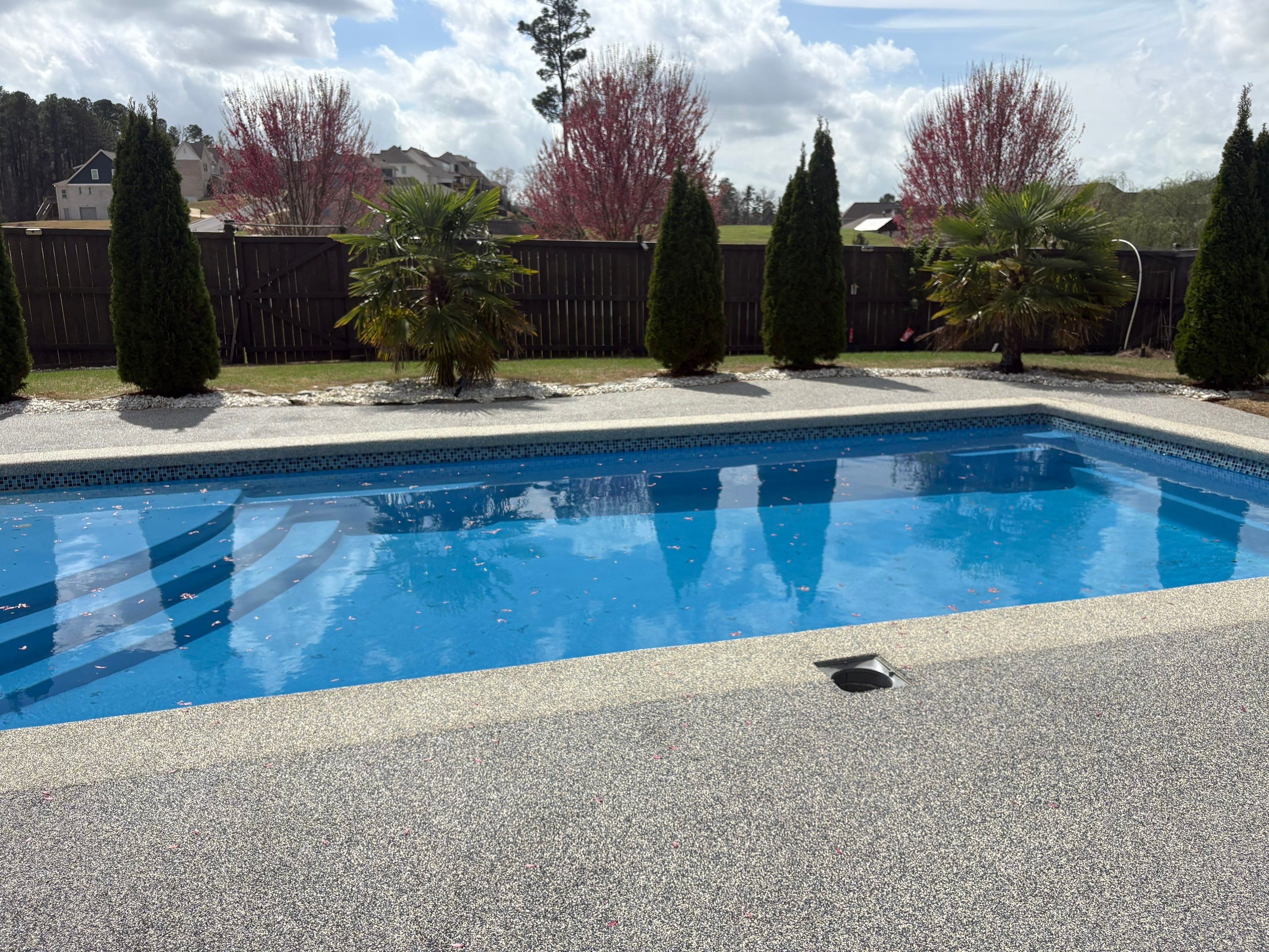 Best pool deck surface for Arkansas summers shown on a Fox hand-troweled rubber pool deck